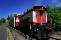 Image of freight train moving down the railroad track